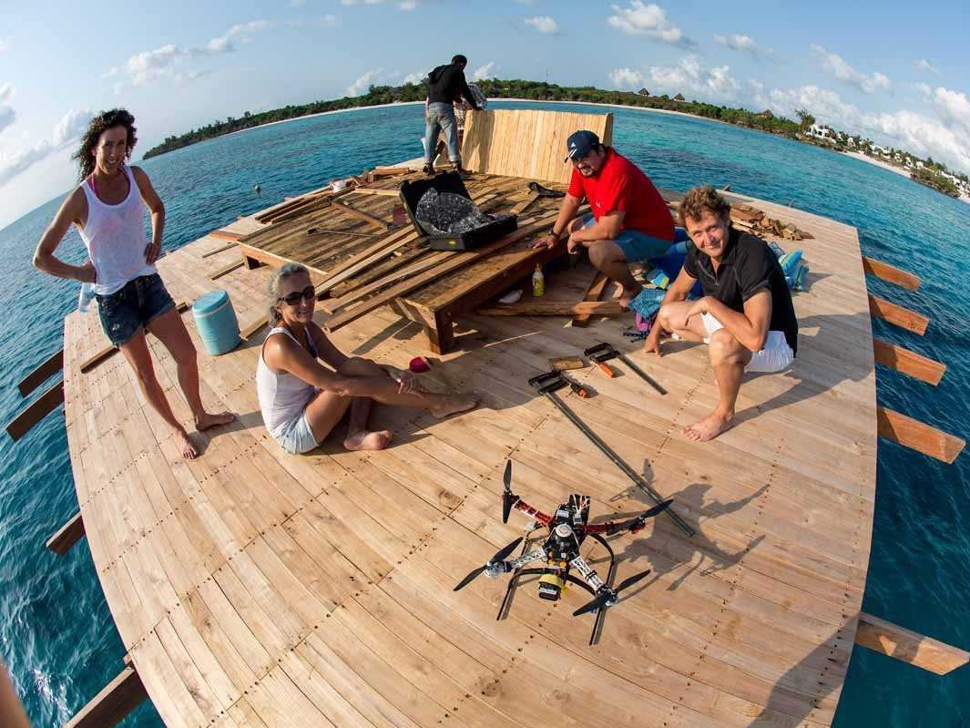 a_small_team_helped_anhede_strategize_the_photo_shoot_of_the_underwater_hotel_room_here_theyre_fixing_a_sun_bed_on_the_upper_deck_for_models_to_pose_on.jpg