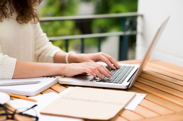 woman_writing_at_laptop.jpg